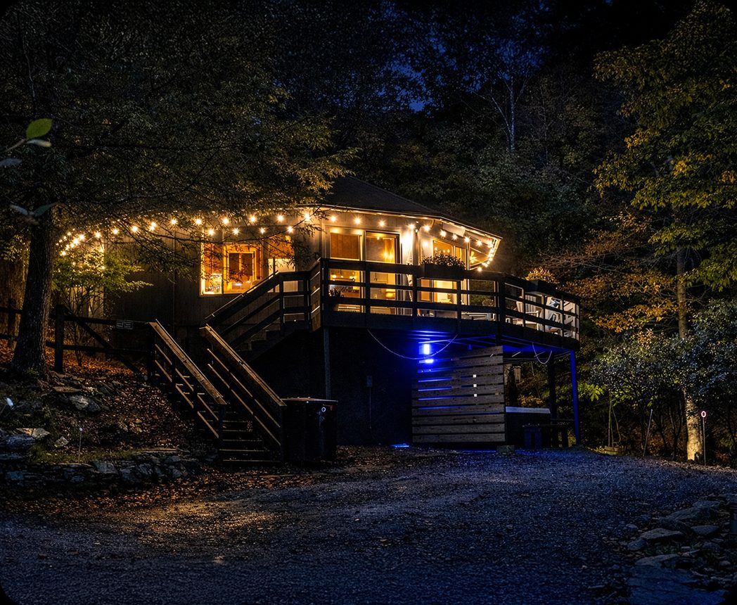 A Hidden Honey Homes retreat property lit at dusk